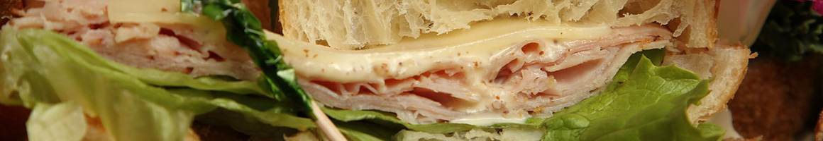 Eating Deli Sandwich at Copeland Deli restaurant in Atlanta, GA.